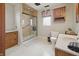 Bathroom showcasing a glass shower, toilet, sink, and vanity with neutral colored wall paint and flooring at 40 N Ritter Ave, Indianapolis, IN 46219