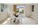 Inviting breakfast nook with a glass table and white chairs next to the bright kitchen at 40 N Ritter Ave, Indianapolis, IN 46219