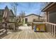 Wooden deck featuring a built-in grill, utility cart, and scenic backyard views for outdoor entertaining at 40 N Ritter Ave, Indianapolis, IN 46219