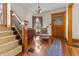 Inviting foyer features beautiful floors, vintage decor and a wooden front door at 40 N Ritter Ave, Indianapolis, IN 46219