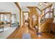 Spacious foyer with hardwood floors, a grand staircase, and stylish interior design at 40 N Ritter Ave, Indianapolis, IN 46219