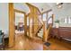Hallway with beautiful wood trim, stairs, and access to the dining room at 40 N Ritter Ave, Indianapolis, IN 46219