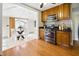 Bright kitchen showcasing stainless steel appliances and adjacent breakfast nook with patio access at 40 N Ritter Ave, Indianapolis, IN 46219