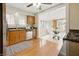 Well-lit kitchen with stainless appliances and adjacent breakfast nook offering plenty of space at 40 N Ritter Ave, Indianapolis, IN 46219