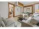 Comfortable living room with neutral tones, wood trim and a large area rug for cozy feel at 40 N Ritter Ave, Indianapolis, IN 46219