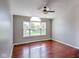 Sunlit bedroom featuring hardwood floors and a large window at 416 Concord Way, Greenwood, IN 46142