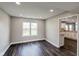 Bright dining room featuring a large window with views of the backyard and wood-look flooring at 416 Concord Way, Greenwood, IN 46142