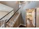 Elegant foyer featuring a staircase with white spindles and contrasting dark wood handrail at 416 Concord Way, Greenwood, IN 46142
