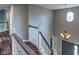 View from the second story landing featuring an octagon window and chandelier in the foyer at 416 Concord Way, Greenwood, IN 46142