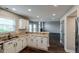 Bright kitchen featuring granite countertops, white cabinetry, and an open floor plan concept at 416 Concord Way, Greenwood, IN 46142