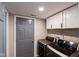 Efficient laundry room featuring modern appliances and sleek white cabinets at 416 Concord Way, Greenwood, IN 46142