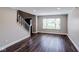Spacious living room with wood-look flooring, large windows, and neutral paint colors at 416 Concord Way, Greenwood, IN 46142