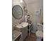 Cozy bathroom featuring a vanity with a vessel sink, decorative mirror, and a toilet at 422 Hege Ave, Columbus, IN 47201