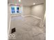 Bright bedroom with plush carpeting, neutral walls, and natural light streaming through the double windows at 422 Hege Ave, Columbus, IN 47201