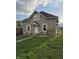 Charming home featuring a well-kept lawn, decorative shutters, and a welcoming front entrance at 422 Hege Ave, Columbus, IN 47201