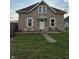 Attractive home with a cozy front yard, traditional shutters, and a bright white front door at 422 Hege Ave, Columbus, IN 47201