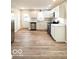 Modern kitchen features white cabinets, stainless steel appliances, and sleek countertops at 422 Hege Ave, Columbus, IN 47201
