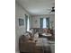 Bright living room with a spacious sectional sofa, modern decor, and large windows at 422 Hege Ave, Columbus, IN 47201