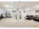 Spacious finished basement featuring neutral walls, carpet, and a home gym area with workout equipment and a sitting area at 4281 Honeysuckle Ln, Zionsville, IN 46077