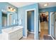 Bright bathroom featuring a single vanity, mirror, walk-in closet and shower/tub combination at 4281 Honeysuckle Ln, Zionsville, IN 46077