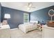 Bedroom with a window, a bed with a white comforter, and gray painted walls at 4281 Honeysuckle Ln, Zionsville, IN 46077
