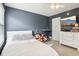 Bedroom with a window, a bed with a white comforter, and gray painted walls at 4281 Honeysuckle Ln, Zionsville, IN 46077