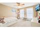 Tan bedroom features large windows with white curtains, and a built-in desk at 4281 Honeysuckle Ln, Zionsville, IN 46077