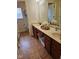 Bathroom featuring double sinks, and a shower behind a glass enclosure at 4383 Round Lake Bnd, Indianapolis, IN 46234