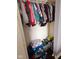 A filled closet is packed with clothes, baskets, blankets and more at 4383 Round Lake Bnd, Indianapolis, IN 46234