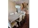 Bright dining area featuring a large table, stylish chairs, and an elegant chandelier at 4383 Round Lake Bnd, Indianapolis, IN 46234
