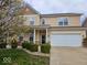 Charming home with a well-manicured lawn, beautiful landscaping, and attached two car garage at 4383 Round Lake Bnd, Indianapolis, IN 46234