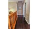 Upstairs hallway with dark wood flooring and access to multiple rooms at 4383 Round Lake Bnd, Indianapolis, IN 46234