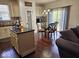Bright kitchen featuring an island, pantry, and dining area, offering ample space at 4383 Round Lake Bnd, Indianapolis, IN 46234