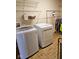 Well-equipped laundry room featuring a modern washer and dryer with ample storage space at 4383 Round Lake Bnd, Indianapolis, IN 46234