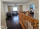 Upstairs living room boasts hardwood floors, large window, and easy access to bedroom at 4383 Round Lake Bnd, Indianapolis, IN 46234