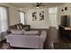 Comfortable living room with ceiling fan, dark wood floors, and neutral paint at 4383 Round Lake Bnd, Indianapolis, IN 46234