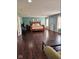 Expansive main bedroom features hardwood floors, sitting area, and ample natural light at 4383 Round Lake Bnd, Indianapolis, IN 46234