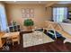 Playroom with play structures, and dark wood floors at 4383 Round Lake Bnd, Indianapolis, IN 46234