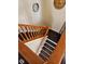Wooden staircase with a landing and view of the lower level at 4383 Round Lake Bnd, Indianapolis, IN 46234
