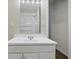 Bathroom showcasing a sink vanity with mirror and medicine cabinet at 443 N Alton Ave, Indianapolis, IN 46222