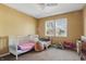 Charming bedroom with two windows and a white crib in the foreground at 443 N Alton Ave, Indianapolis, IN 46222
