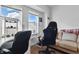 Bedroom with modern white desk, rolling chair, and large double window at 443 N Alton Ave, Indianapolis, IN 46222