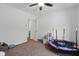 Bright bedroom with a ceiling fan and ample space for play and activities at 443 N Alton Ave, Indianapolis, IN 46222