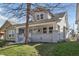 Charming two-story home with a cozy front porch and well-maintained lawn at 443 N Alton Ave, Indianapolis, IN 46222