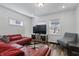 Inviting living room with bright lighting, wood-look floors, and comfortable contemporary furnishings at 443 N Alton Ave, Indianapolis, IN 46222