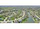 Aerial view of a residential neighborhood with many trees and lake at 476 Sapphire Dr, Carmel, IN 46032