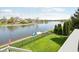 Backyard view overlooking lake with private boat dock and well maintained lawn at 476 Sapphire Dr, Carmel, IN 46032