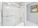 Clean bathroom featuring a glass door shower-tub combo and a soft, neutral color scheme at 476 Sapphire Dr, Carmel, IN 46032