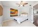 Comfortable bedroom with neutral carpet, ceiling fan, and decorative wall art at 476 Sapphire Dr, Carmel, IN 46032