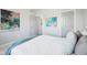 Bedroom with modern decor, featuring neutral colors, art and plush bedding at 476 Sapphire Dr, Carmel, IN 46032